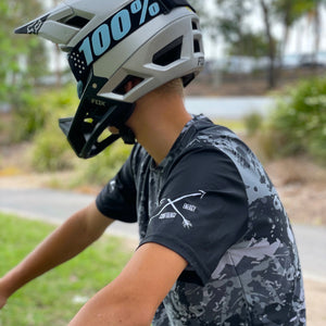 Kai Pyyvaara wearing our short sleeve black camo jersey . Available in youth sizes and made in Australia from recycled plastic.